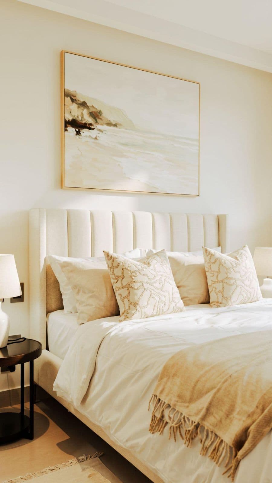 Bedroom with linen bedding and a large beach painting