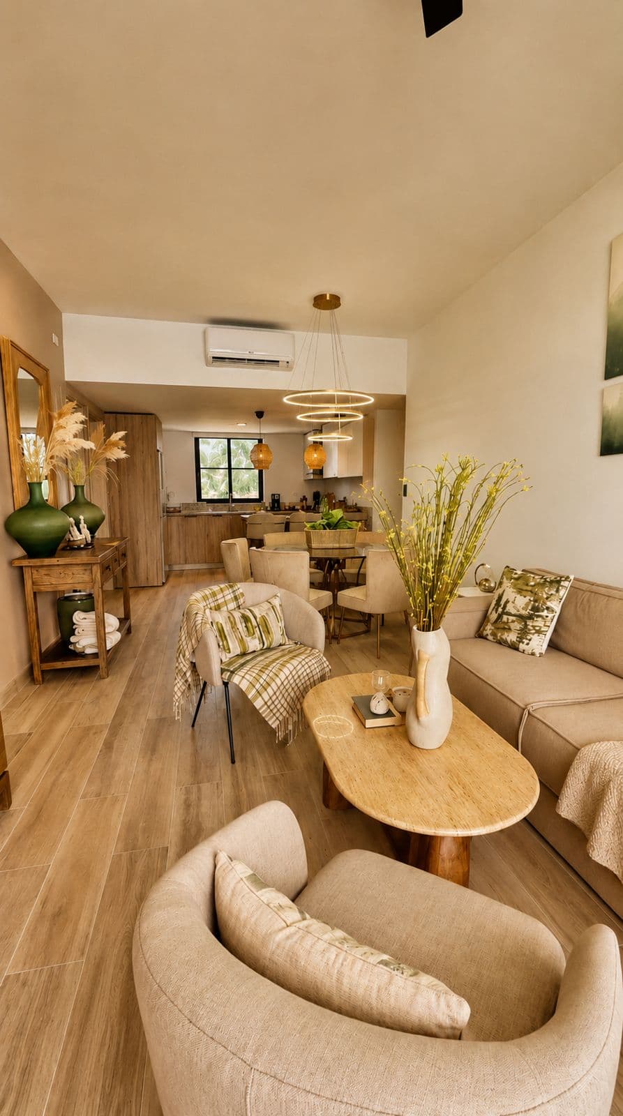 Bright living room with a dining area and natural wood details in a managed apartment