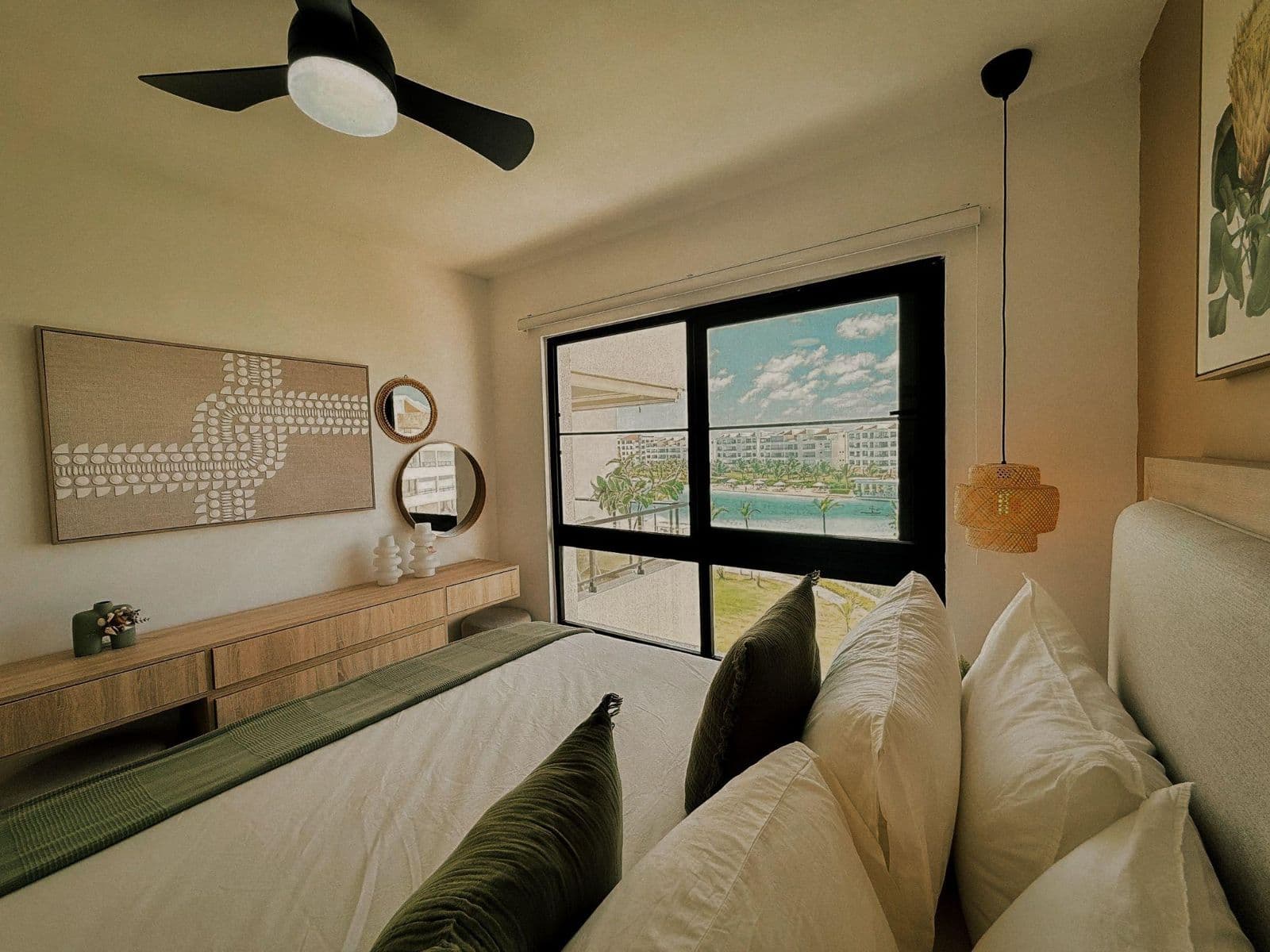 Bedroom with a large window looking out to a lagoon